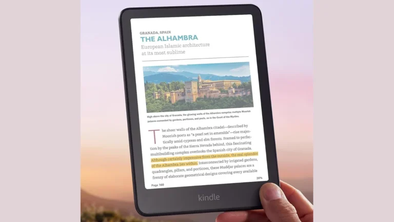 Kindle Colorsoft held in one hand, showing a travel guide page with a colour photo of the Alhambra and a passage highlighted in yellow