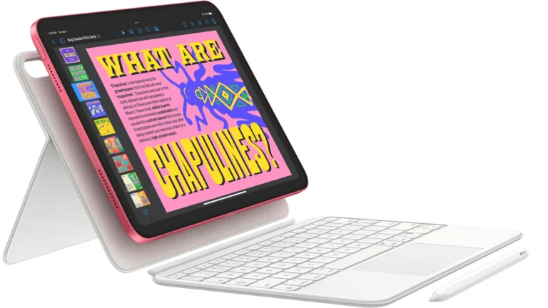 iPad 11-inch in Pink propped upright in a white keyboard folio with a detached keyboard and an Apple Pencil lying beside it