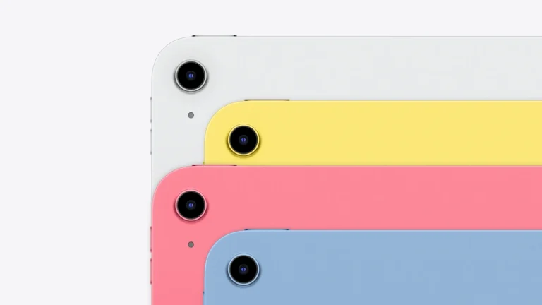 Rear view of four iPad 11-inch units in Silver, Yellow, Pink and Blue stacked in a row, showing the single rear camera and the flat aluminium back